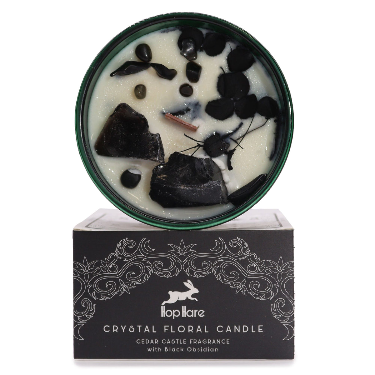 Hop Hare Knight of Swords crystal candle open, black obsidian chunks and dark dry flowers in the wax, on its black box