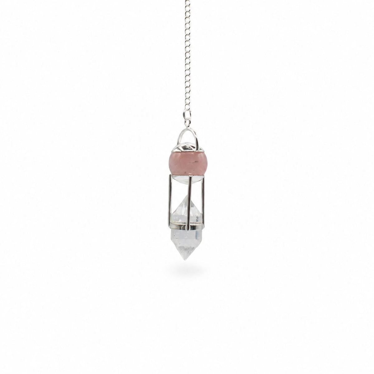 Heart Whisperer pendulum hanging alone by its chain against a plain white background