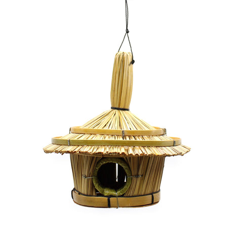 Small round seagrass bird box, three-quarter view on a white background