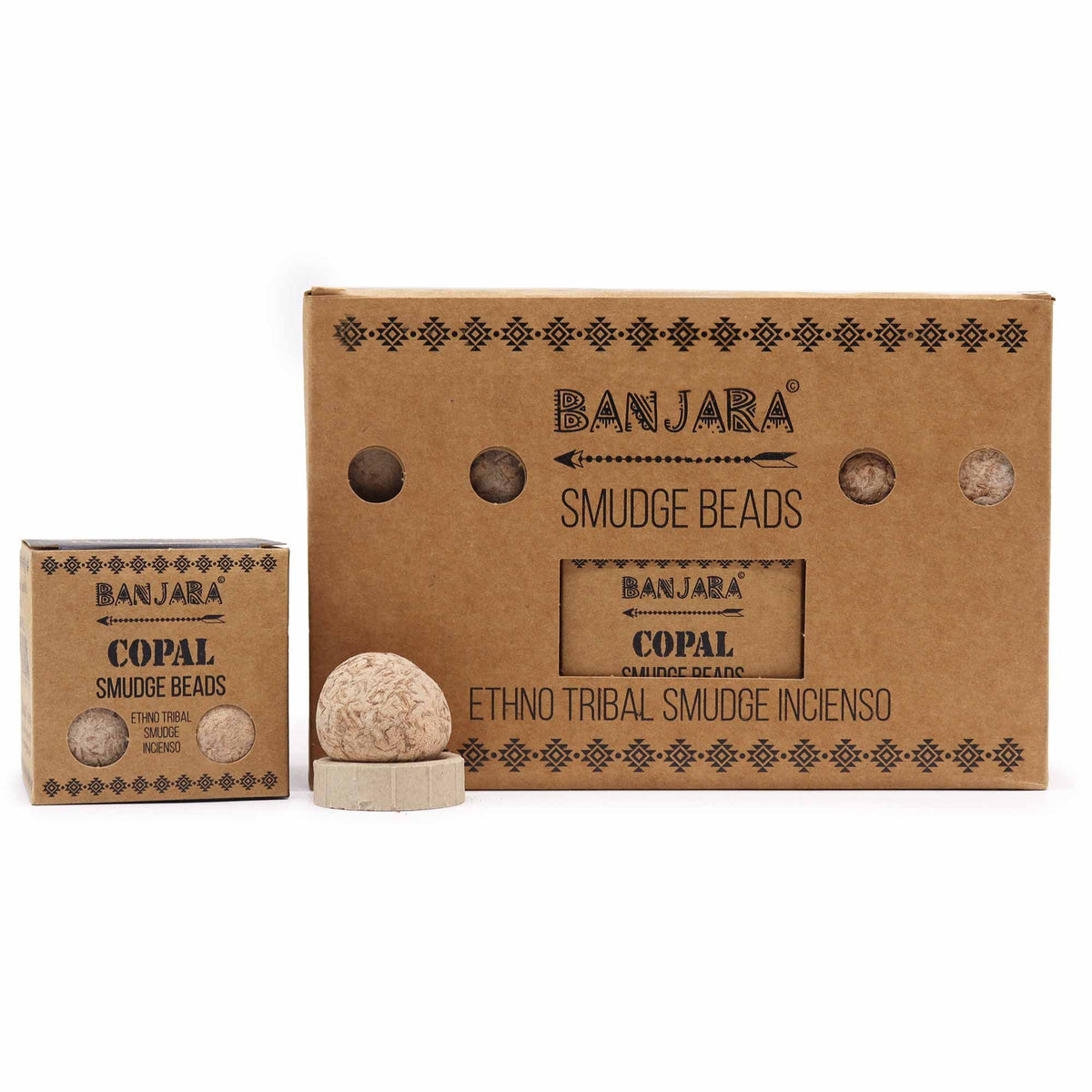 Banjara Smudge Beads, Copal in a small kraft box beside a larger display box and one pale bead