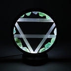 Earth halo lamp illuminated against a dark background