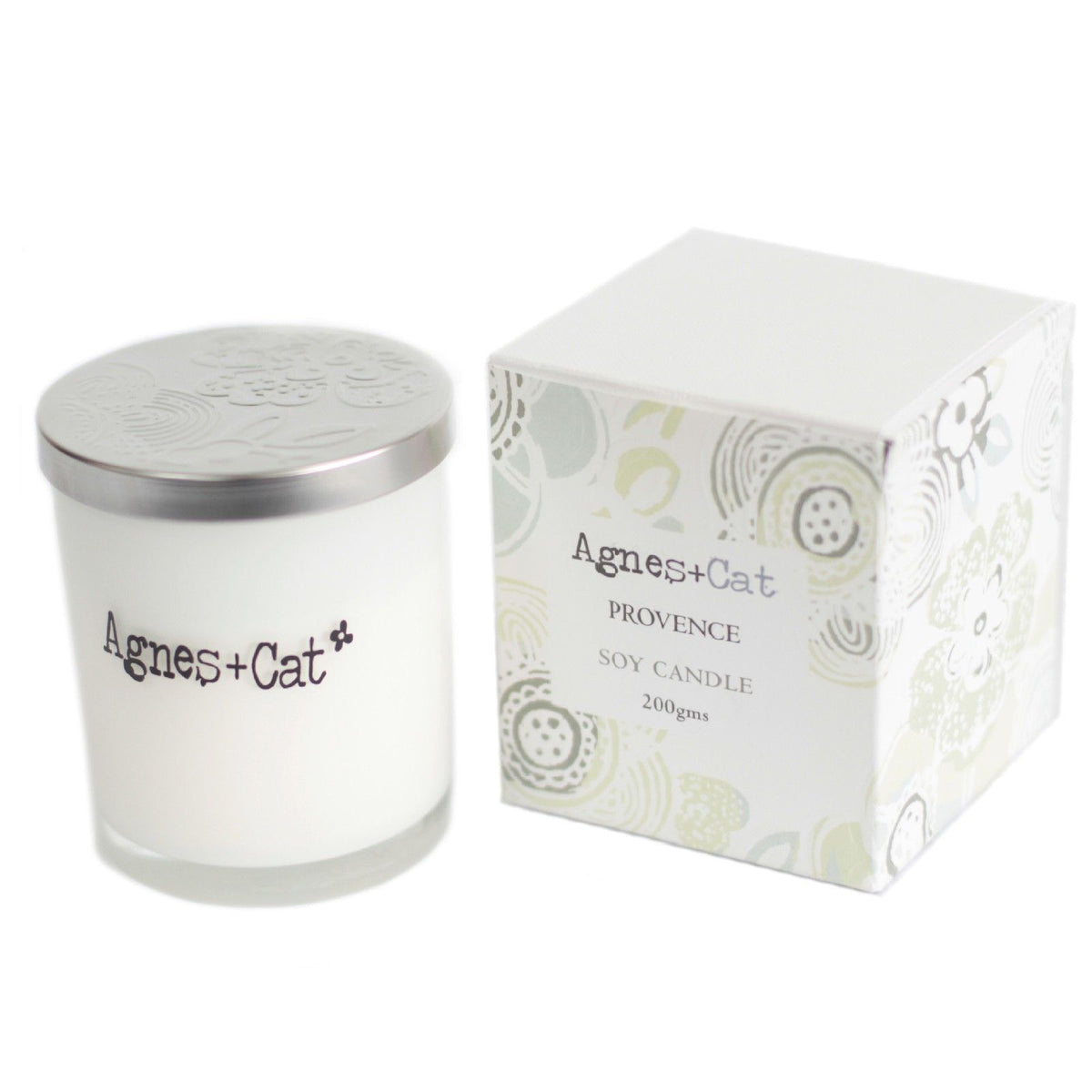 Agnes + Cat Votive Candle, Provence, white glass candle with silver lid beside its patterned box