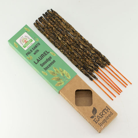 Loose Laurel smudge incense sticks laid out beside their retail box