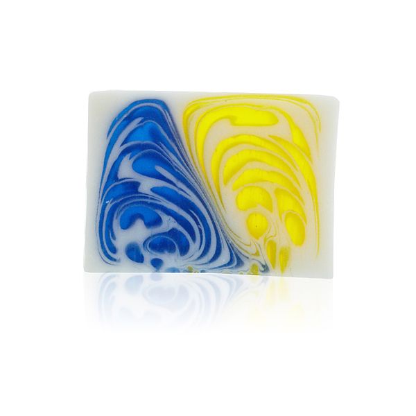 Jasmine & Greentea soap slice shown alone from the front, with blue and yellow swirls