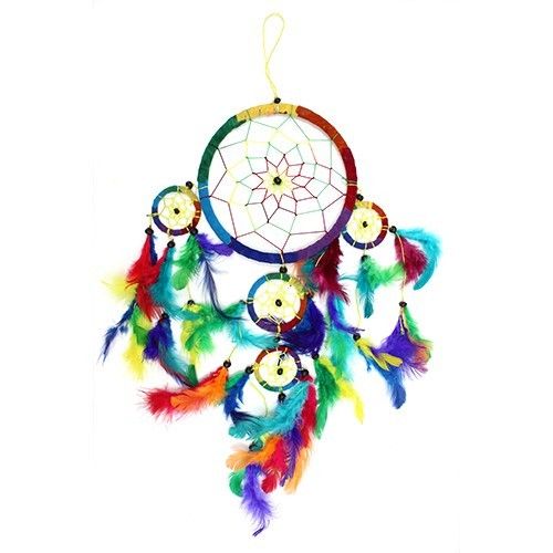 Rainbow Bali dreamcatcher hanging against a white background, with colourful feathers and smaller hoops