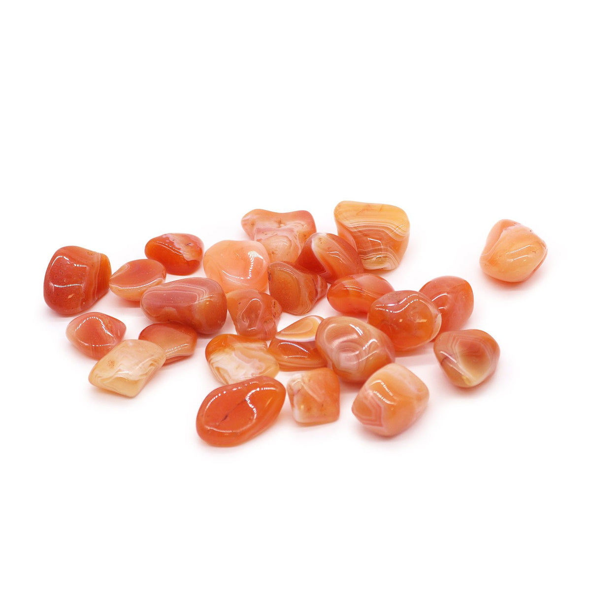 L Tumble Stones, Carnelian, polished orange and peach stones with pale banding arranged on a white background
