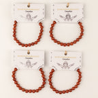 Several Carnelian bracelets displayed with presentation cards
