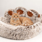 PAW large paw-shaped bed with a cat resting in the centre