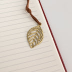 Close-up of the leaf-shaped bookmark on a lined page