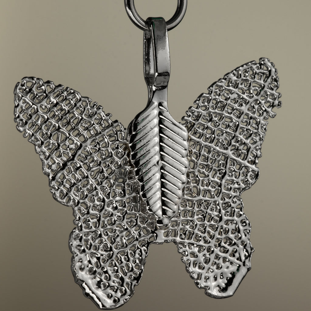 Close-up of the butterfly charm