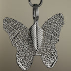 Close-up of the butterfly charm