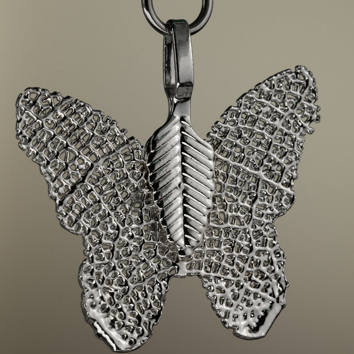Close-up of the butterfly charm