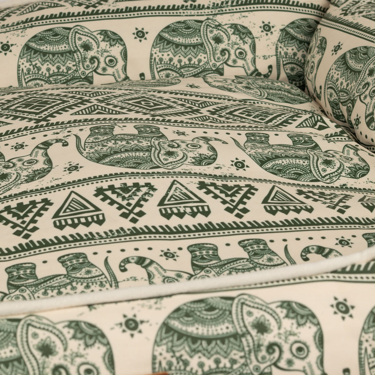 Close-up of the bed's patterned padded sleeping area