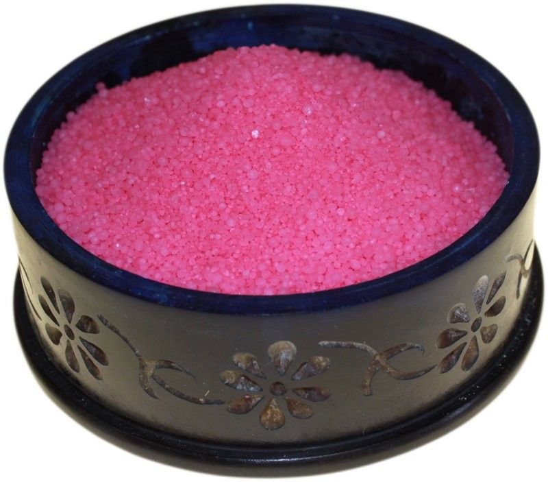 Bubblegum Simmering Granules in a dark patterned bowl, viewed close-up from above