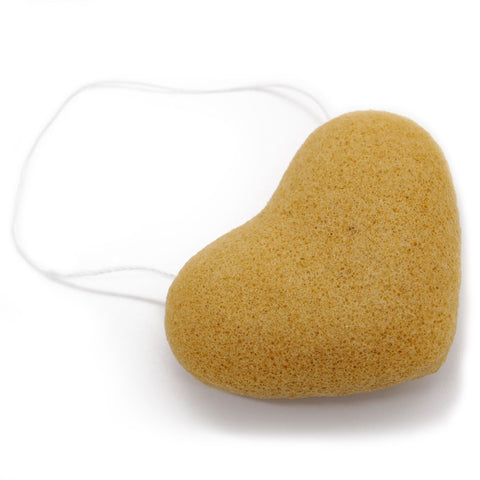 Konjac Heart Sponge, Peach, a golden peach-coloured sponge with a white hanging loop, angled view