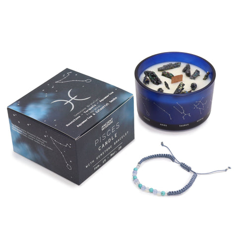 Pisces candle and closed gift box standing together with the gemstone bracelet in front