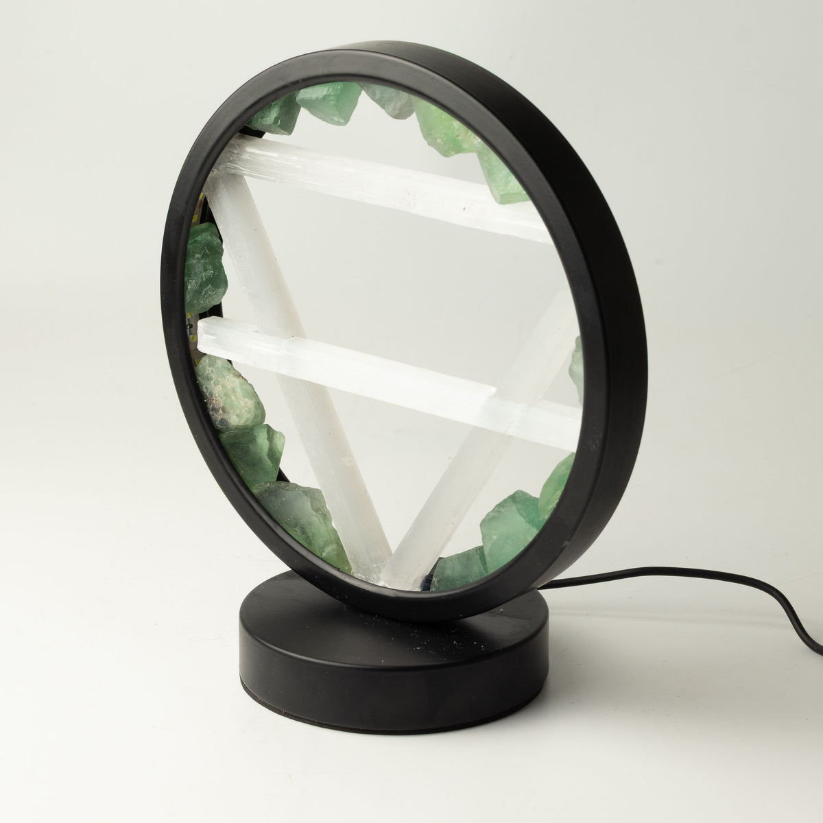 Angled view of the lamp's circular frame and base