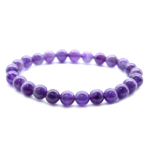 Amethyst bracelet arranged in a circle on a plain white background, close-up view