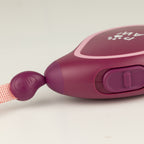 Close-up of the lead’s button control and pink tape