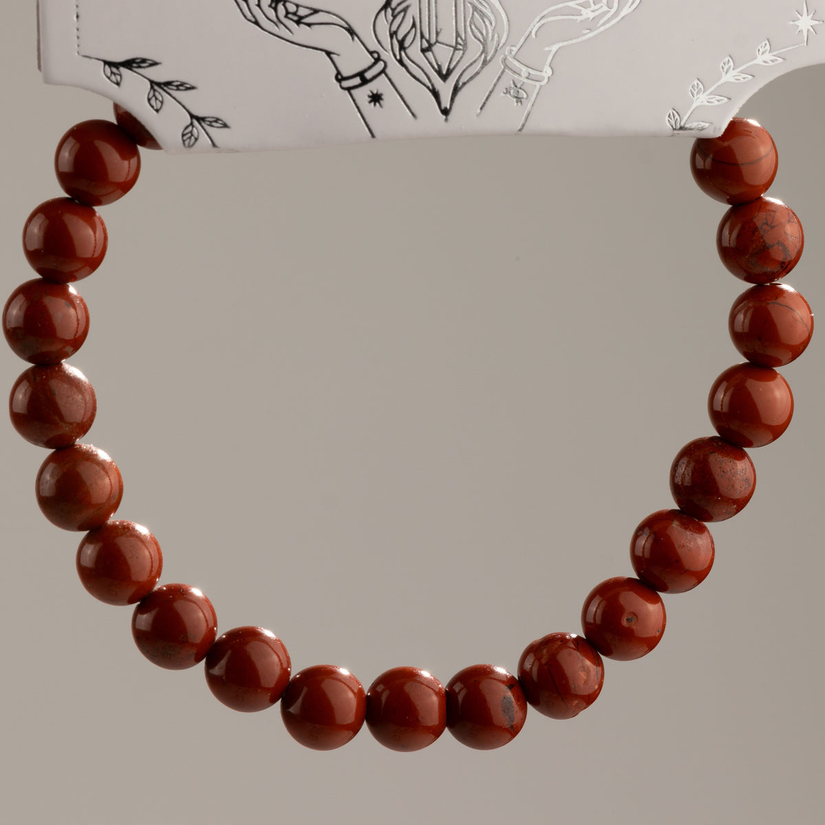 Carnelian bracelet arranged in a circle to show the bead pattern