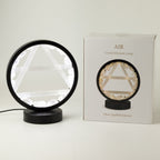 Lamp beside its box showing the Air symbol