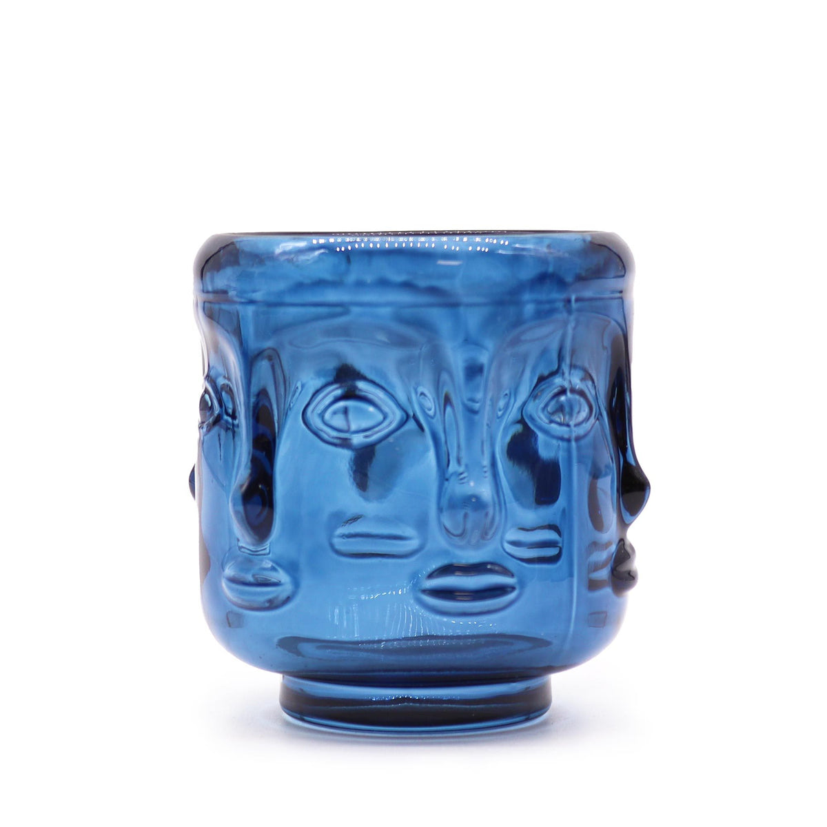 Buddha Faces Candle Jar, Royal Blue, front view of a blue glass jar with sculpted faces