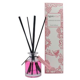 140ml Reed Diffuser, Japanese Bloom in a pink bottle with black reeds beside patterned pink packaging