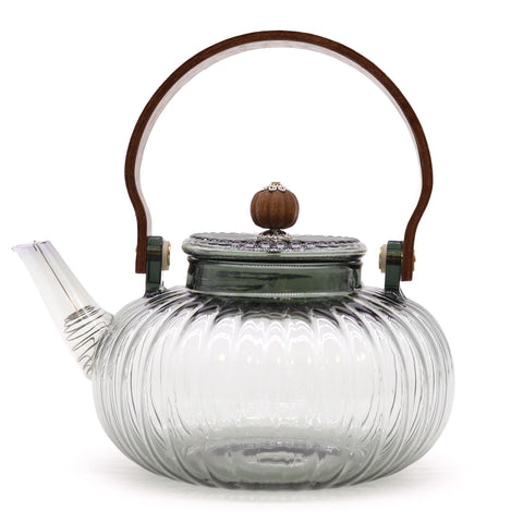 Charcoal ribbed glass teapot shown from the front with its lid, curved handle and long spout