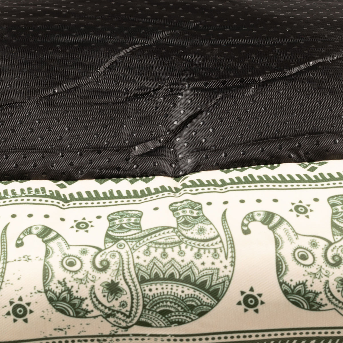 Textured black base of the green pet bed