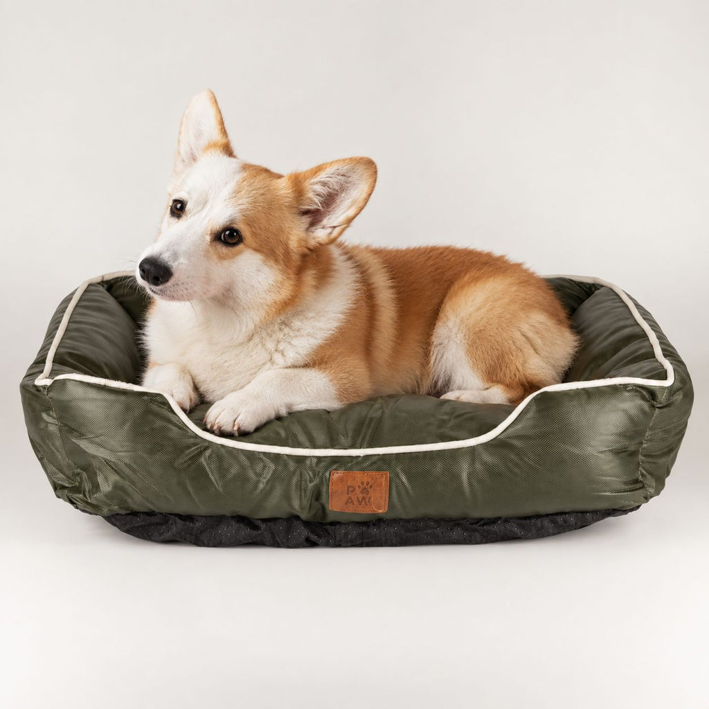 PAW small khaki-green pet bed with a dog resting inside