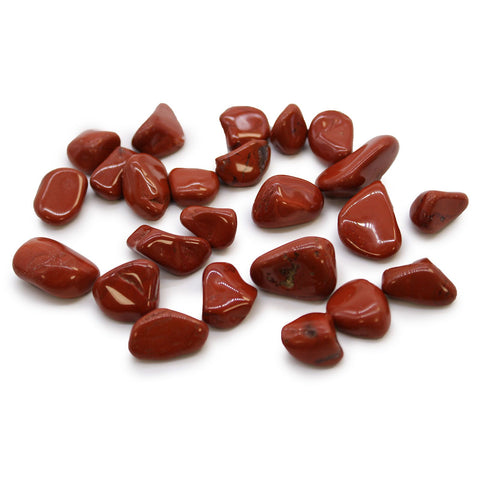 Small African Tumble Stones, Jasper, Red, a group of polished red stones on a white background