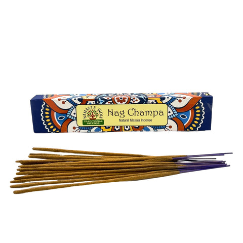 Nagchampa incense box with a row of loose brown sticks and purple ends against white