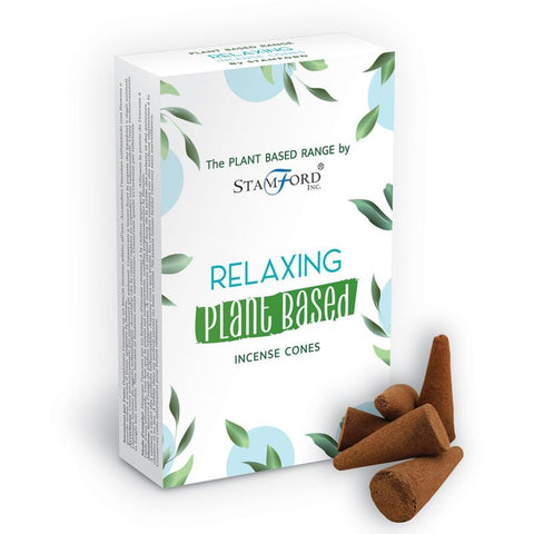 Relaxing plant based incense cones in a white leafy box, with several brown cones beside it