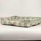 Side view of the green elephant-patterned pet bed