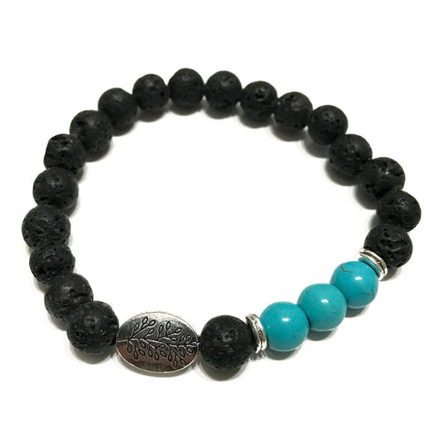 Leaf Turquoise bracelet on a plain white background, showing the black beads and leaf charm