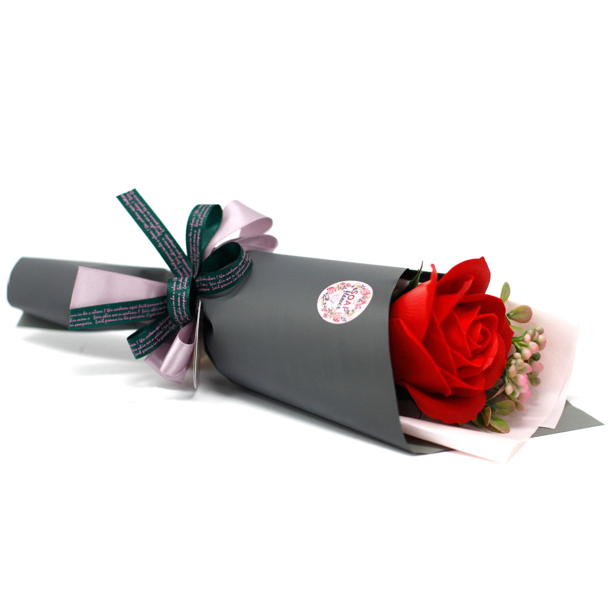 Soap Flower Rose Bouquet wrapped in grey paper, close view of the red roses