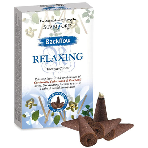A box of Relaxing backflow incense cones with loose cones beside it.