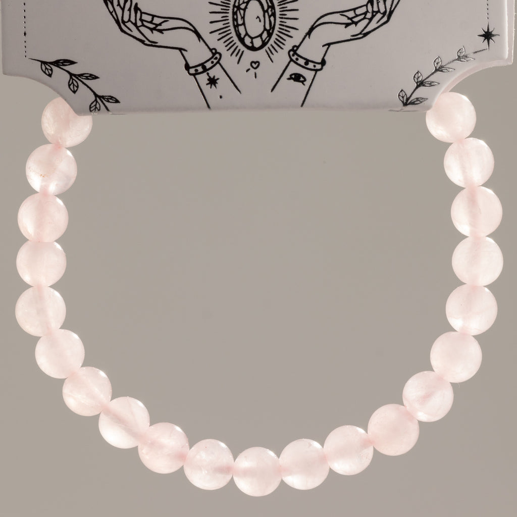 Close view of the rose quartz bracelet hanging in a loop