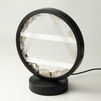 Angled view of the lamp's circular frame and base