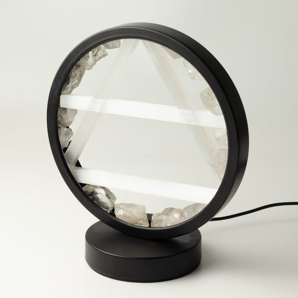 Angled view of the lamp's circular frame and base