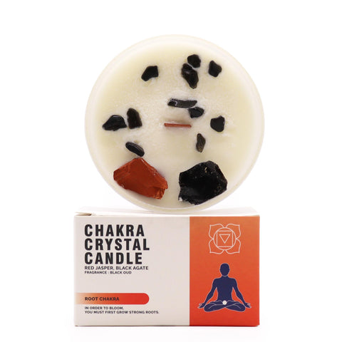 Root Chakra Crystal Candle with red jasper and black agate on top, standing above its box