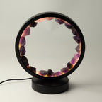 Zen Spirit amethyst halo lamp lit, showing the circular ring of purple stones