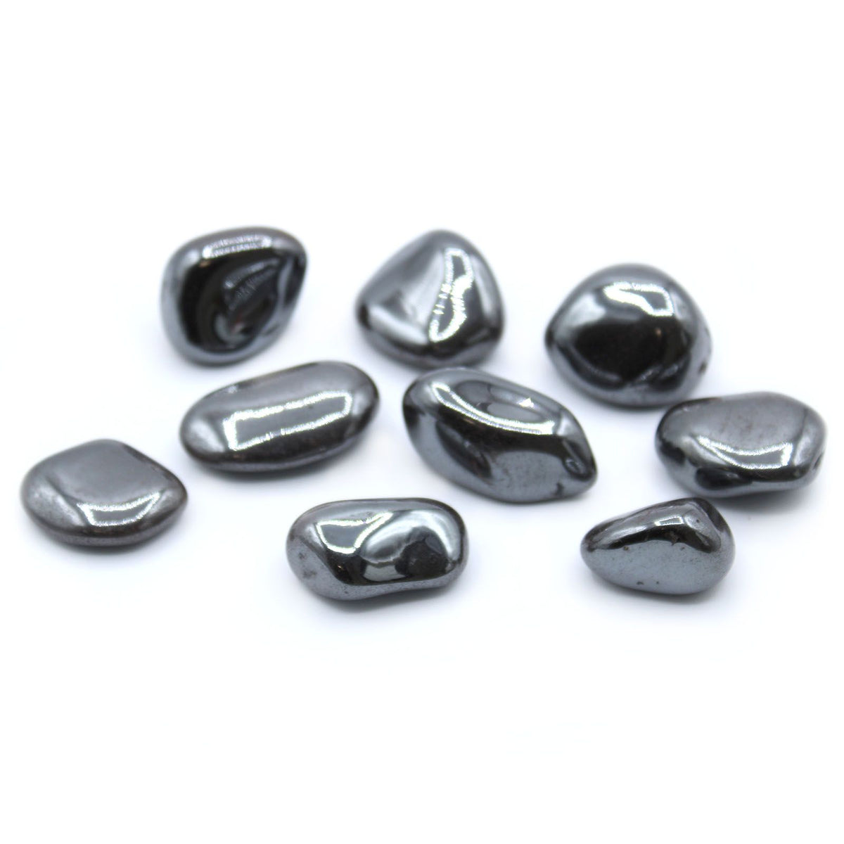 L Tumble Stones, Hematite, polished dark grey stones shown together on a white background