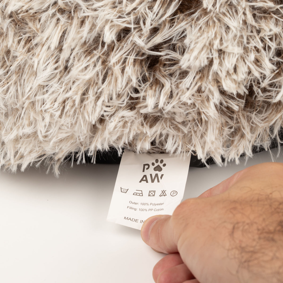 Care label beneath the shaggy bed