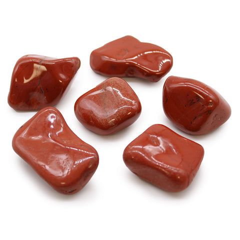 Large African Tumble Stones, Jasper, Red, several polished red stones displayed together on white