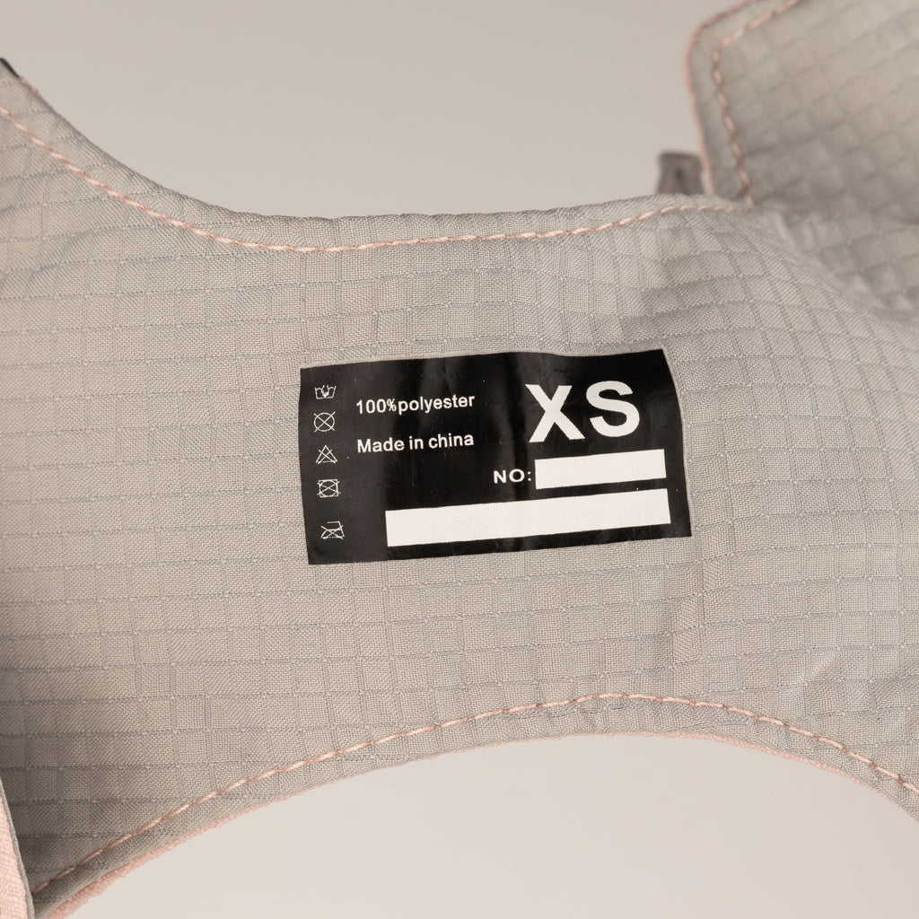 Close-up of harness size and material label