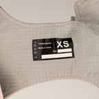 Close-up of harness size and material label