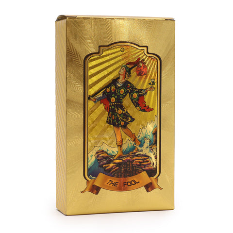 Golden Tarot Cards in a gold box, front view showing The Fool card artwork