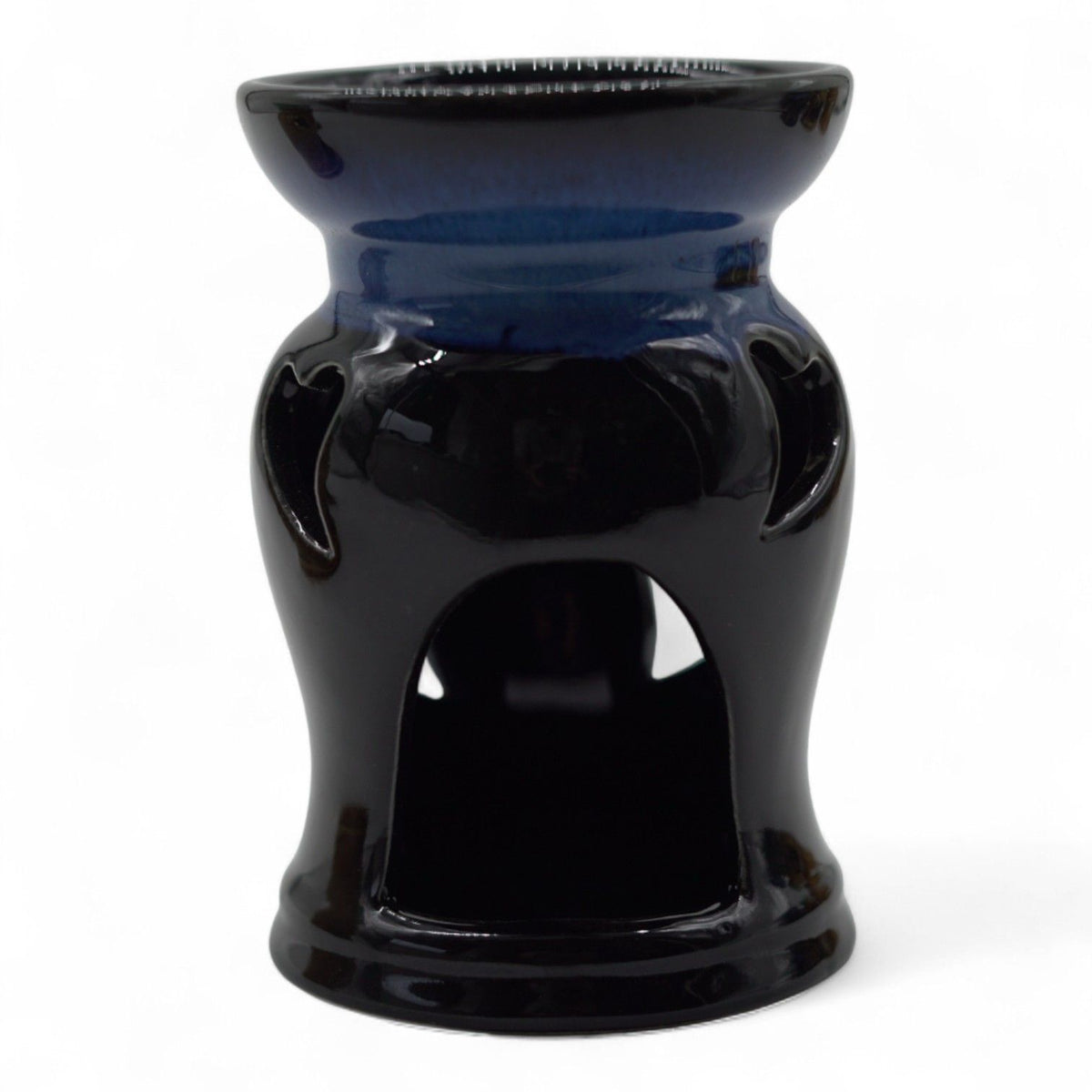 Ceramic oil burner with heart cut-outs in a black and blue glaze, front view