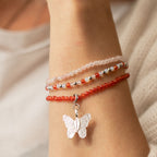 Three bracelets worn around a wrist